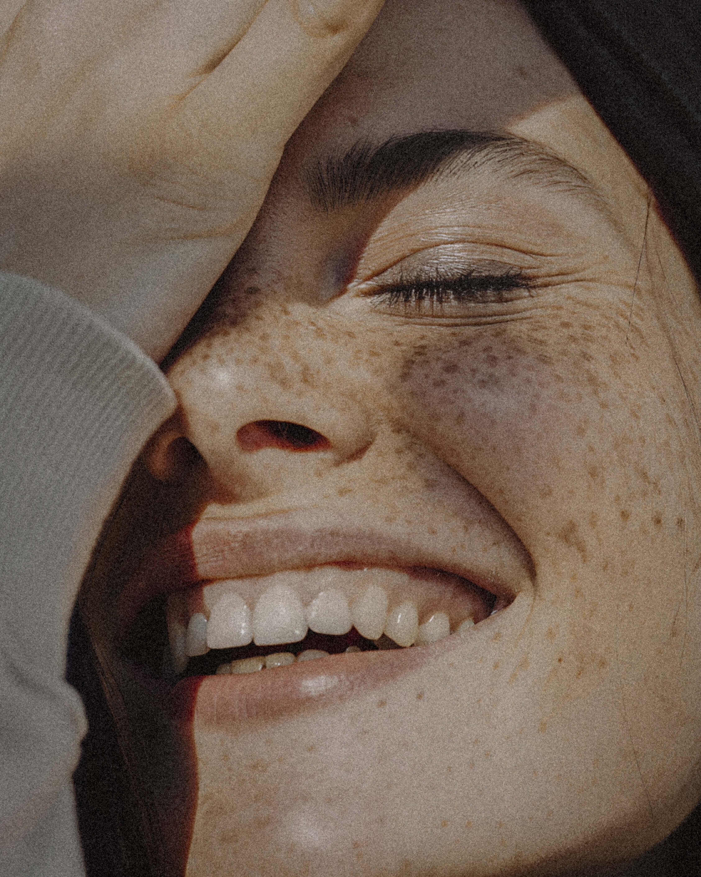 Editorial portrait — woman smiling in warm natural light